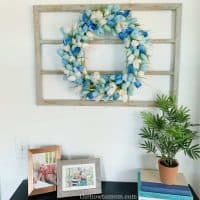 Hang a wreath on an empty window frame