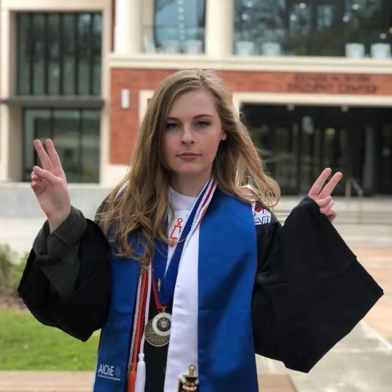 Woman Posing in Graduation Clothing on Street · Free Stock Photo